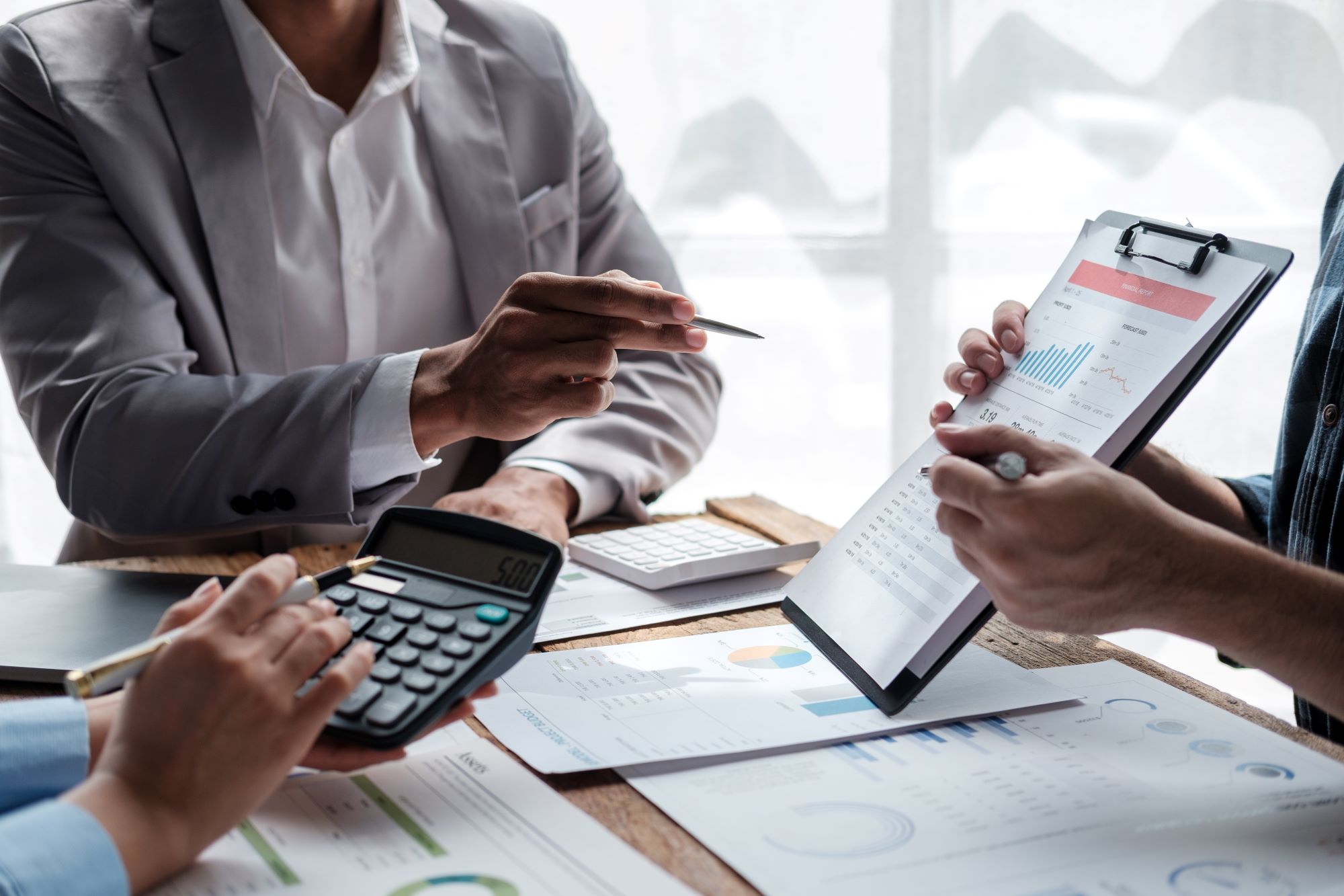 diverse-colleagues-gather-brainstorm-discuss-finan-2023-11-27-05-01-53-utc